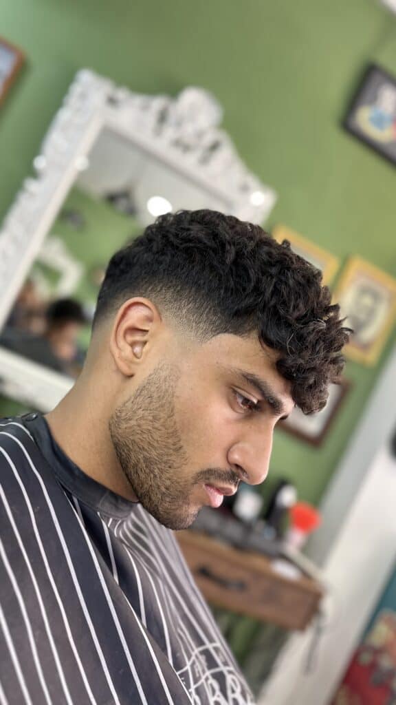 Fresh skin fade on curly hair at Bad Monkey Barber Shop in Pong, Phuket.