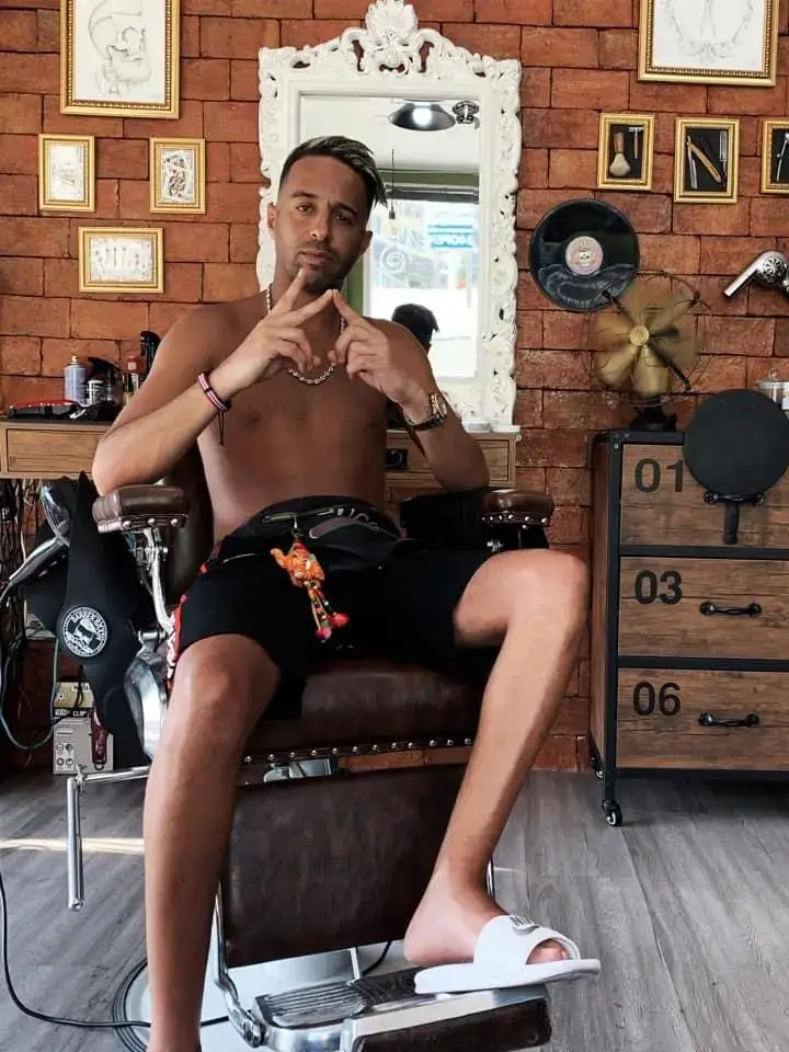 French rapper Naps posing after a haircut at Bad Monkey Barber Shop Patong in Phuket.