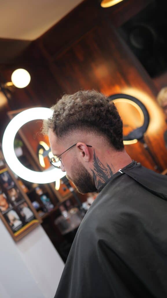Man getting a fresh fade at Bad Monkey Barber Shop in Patong, Phuket.